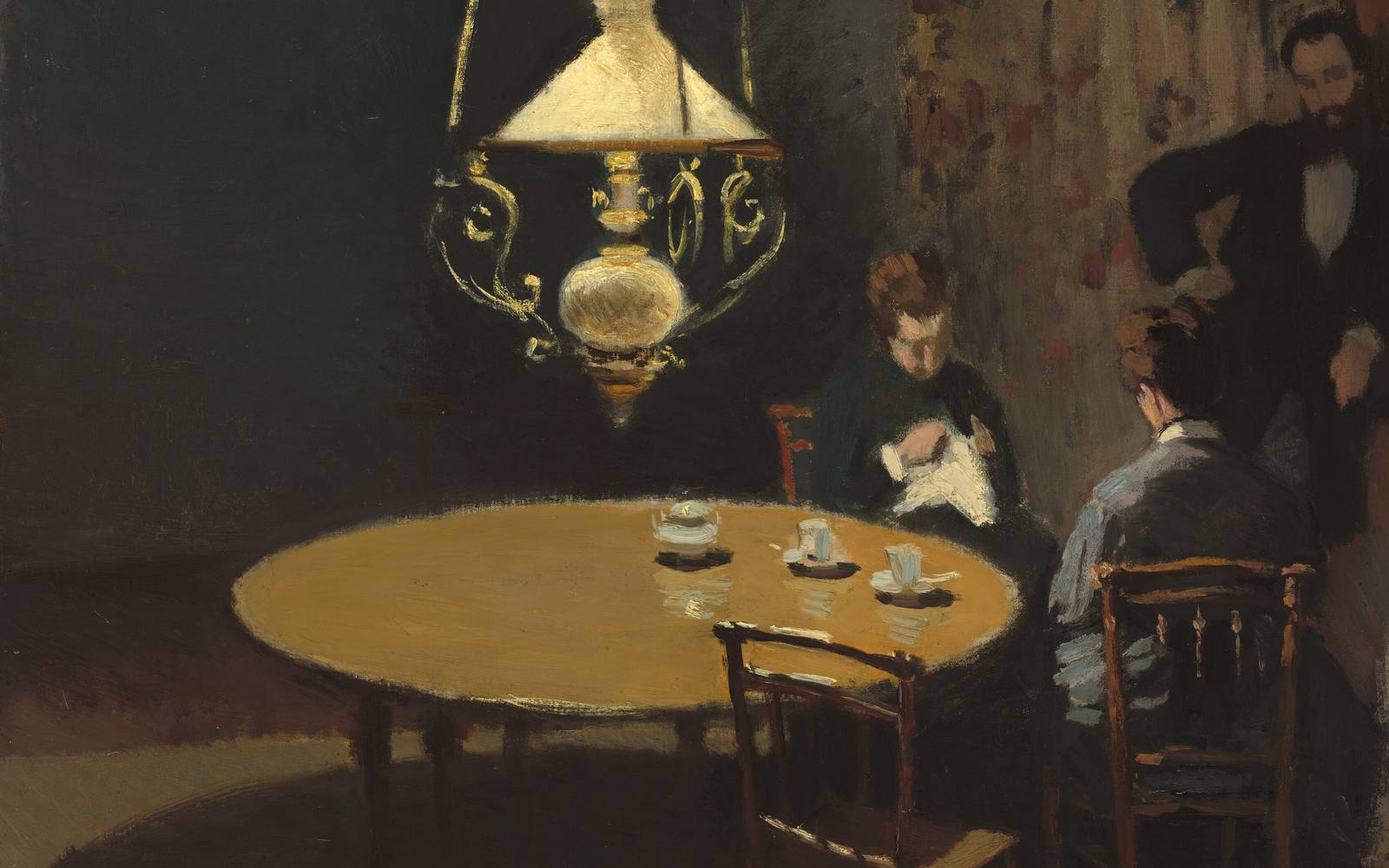 A painting of a lamp-lit room after dinner. Two women sit close together, one sewing, and a bearded man stands beside them.